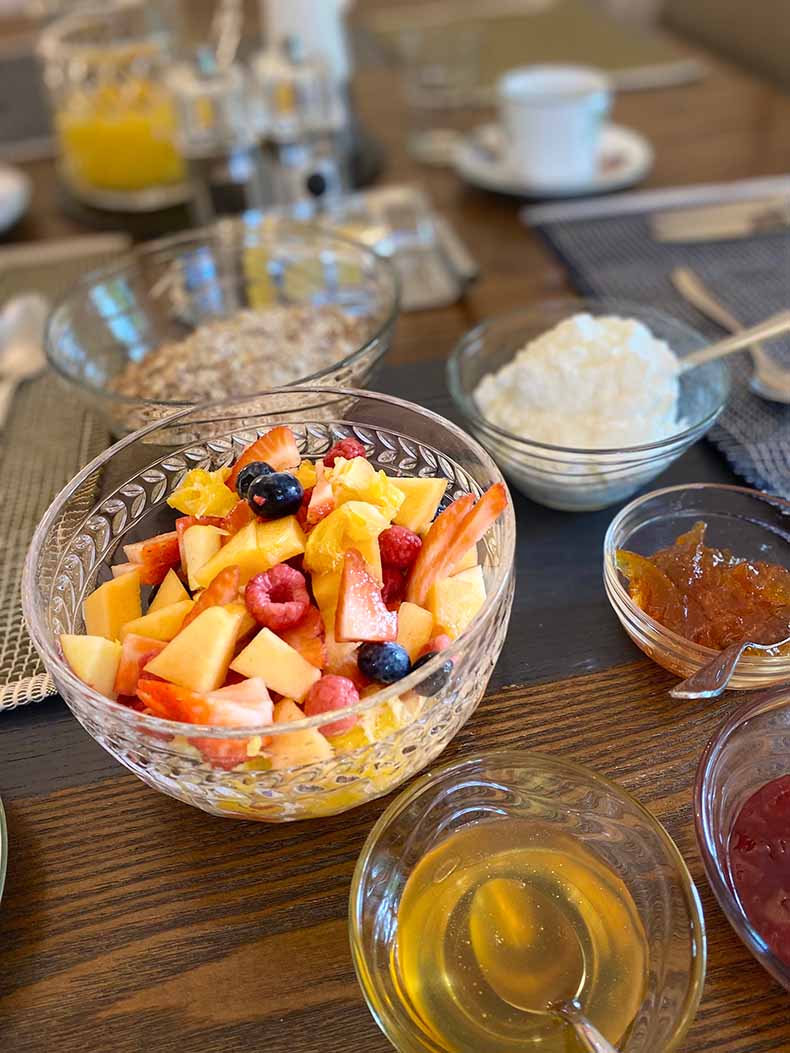 Fresh fruit salad, yoghurt, jams and honey for breakfast